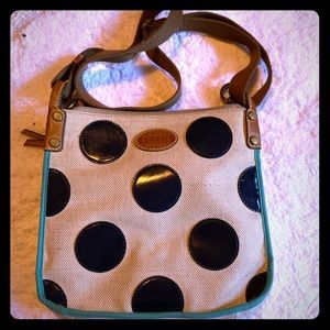 Polka dot fossil cross body purse.